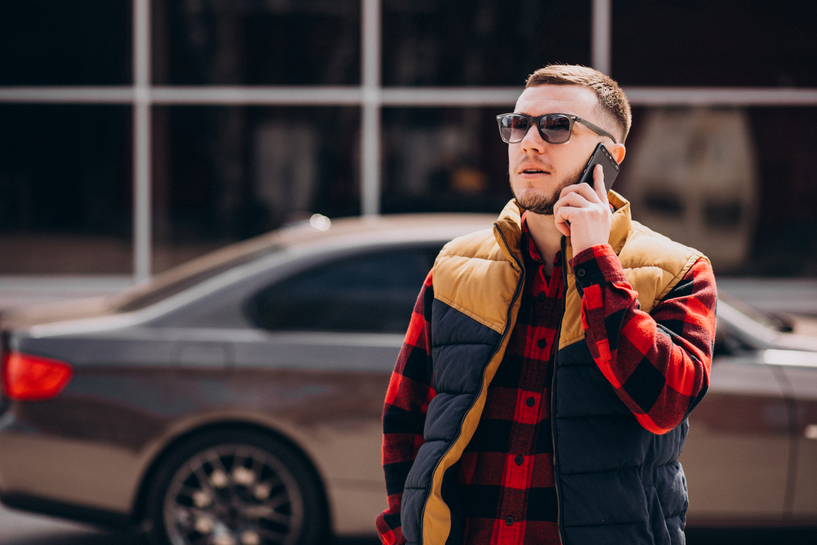 Stylish Lamborghini sports sunglasses worn by a model outdoors