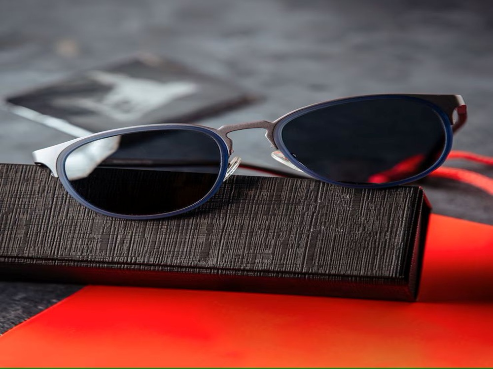 Close-up of Mercedes-Benz logo on sunglasses frame